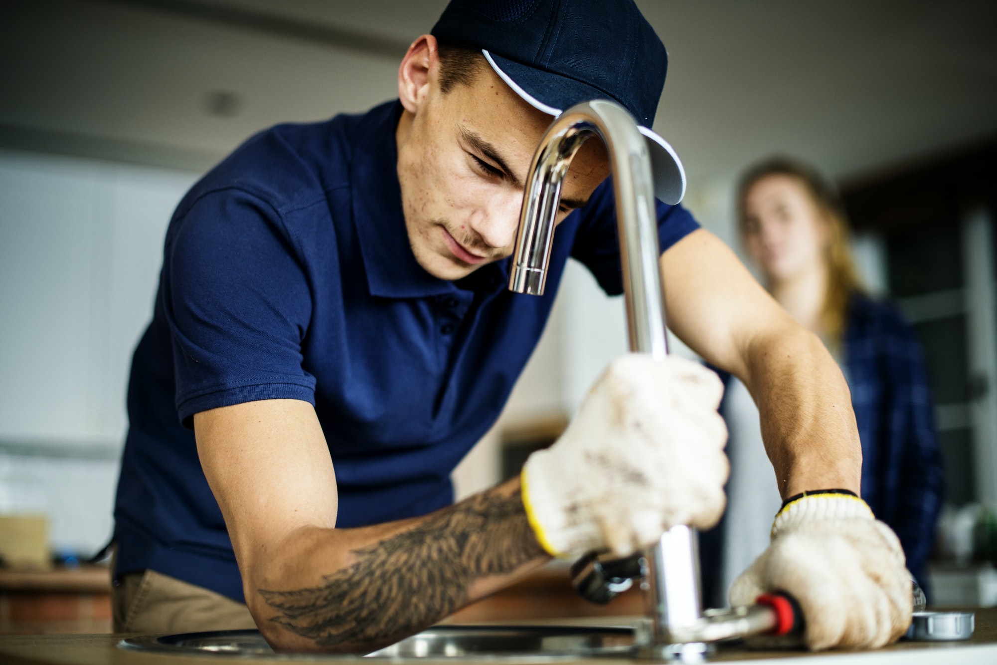 plumber-fixing-kitchen-sink.jpg
